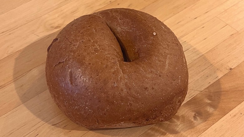 Whole wheat bagel on table