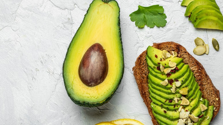 Large avocado next to toast