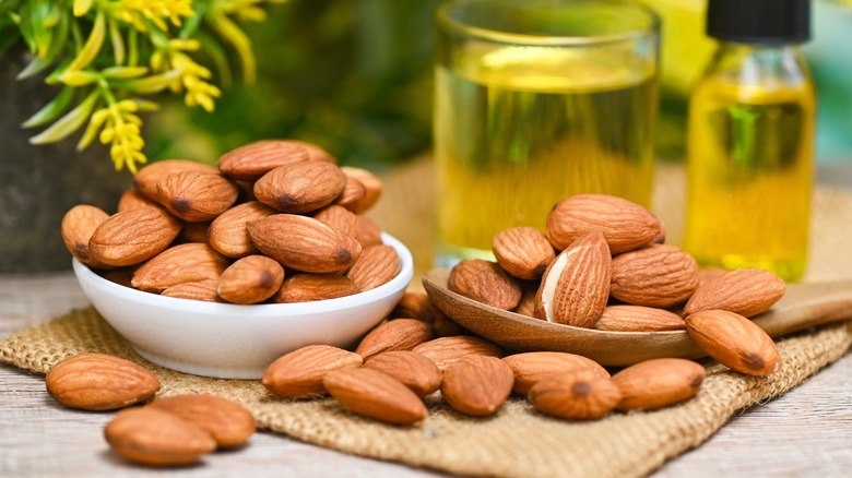 A bowl and spoon filled with almonds