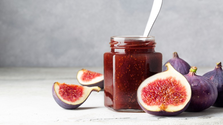 Fig jam in a glass jar.