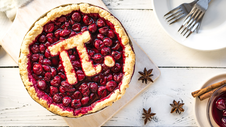 Cherry pie with pi symbol topper