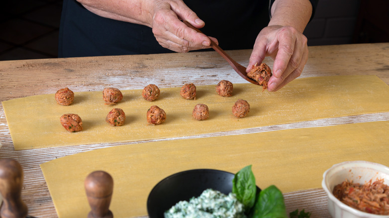 person filling ravioli