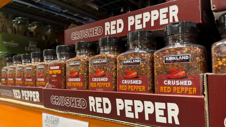 Shelf of Kirkland Signature Crushed Red Pepper bottles