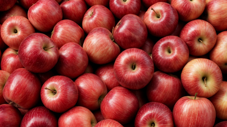 A bunch of red apples piled on top of each other