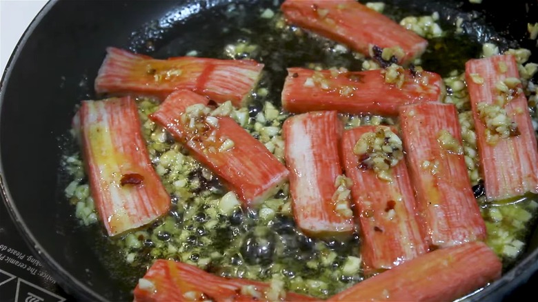 Sautéing imitation crab in pan