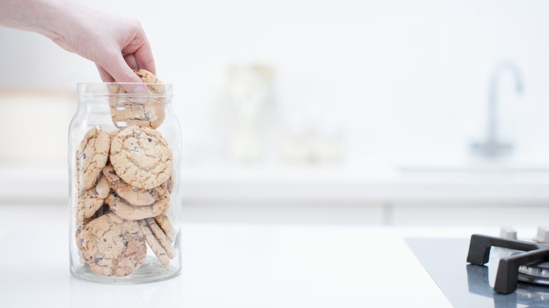 hand reaching into cookie jar