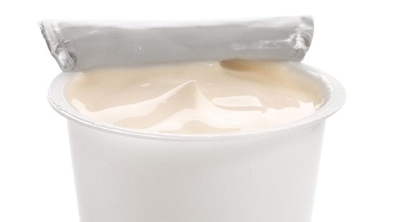 an open cup of yogurt