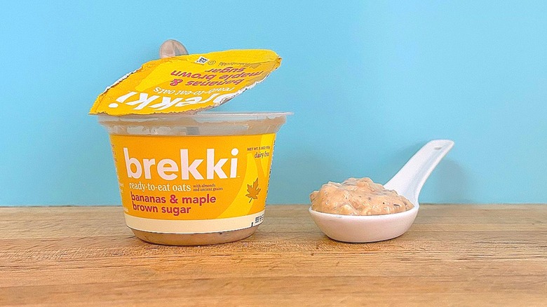 Container and spoonful of Brekki Bananas & Maple Brown Sugar-flavored ready-to-eat oats