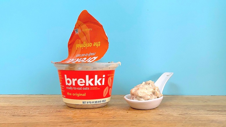 Container and spoonful of Brekki Original-flavored ready-to-eat oats