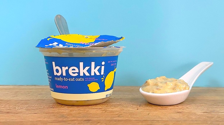 Container and spoonful of Brekki Lemon-flavored ready-to-eat oats