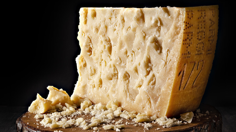 Crumbled wheel of parmesan cheese