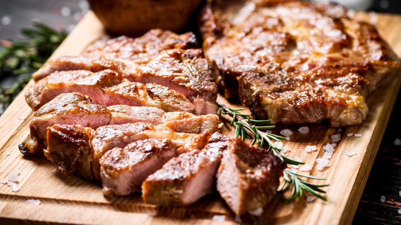 Sliced pork chop on cutting board