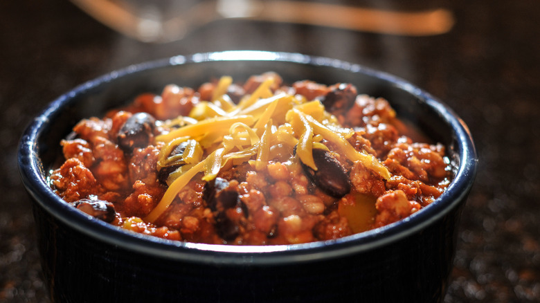 Bowl of chili on table