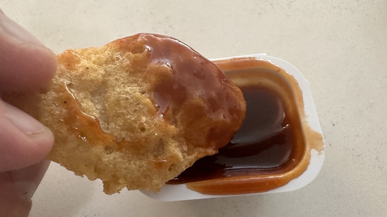 nugget dipped in bbq sauce