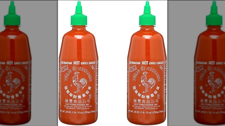 two Huy Fong Sriracha bottles