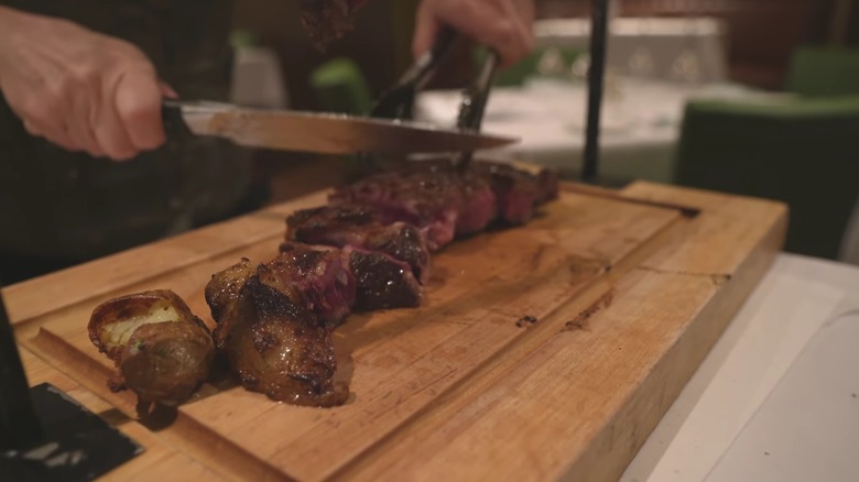 Wagyu tomahawk being sliced