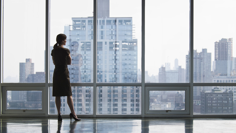 Woman against city backdrop