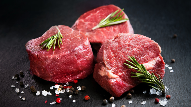 Three fillet steaks with rosemary