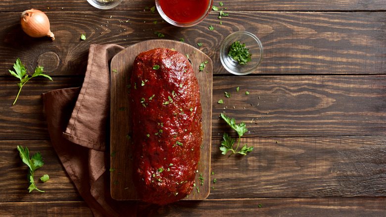 Glazed meatloaf on chopping board