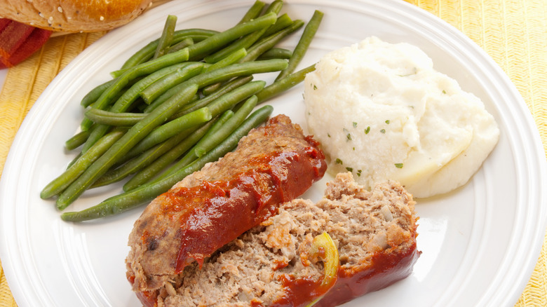 Meatloaf plated with green beans