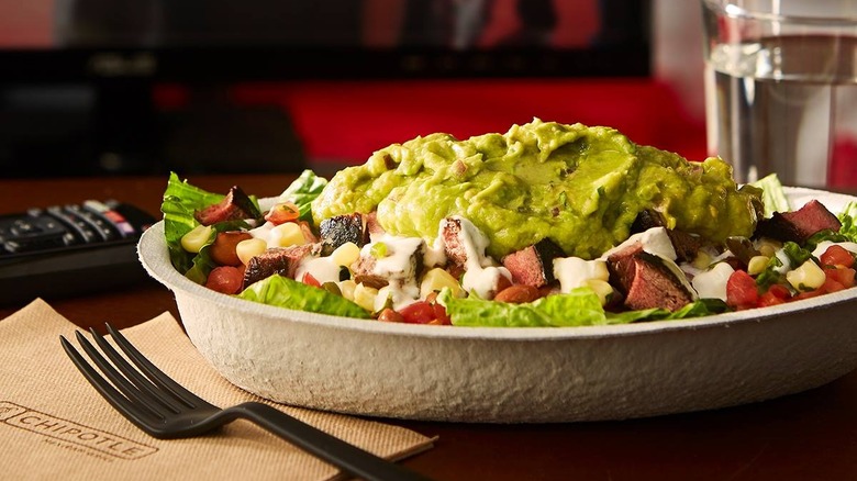 Chipotle salad on table