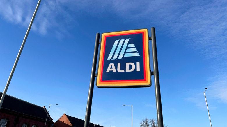 Aldi sign against blue sky