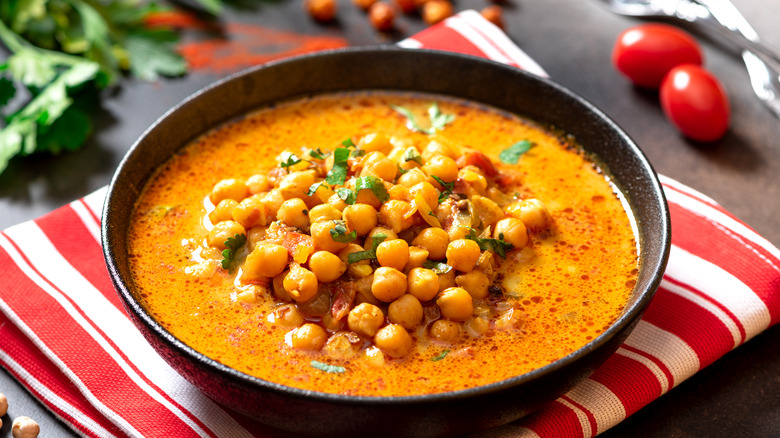 curried chickpea soup in a cast iron skillet