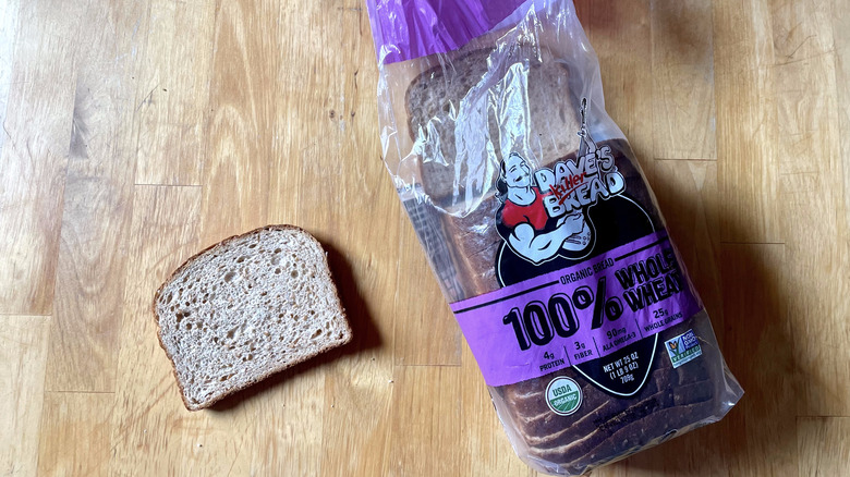 Slice and loaf of whole wheat bread