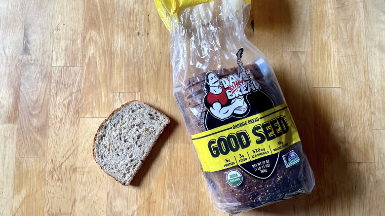 slice of bread next to Good Seed loaf