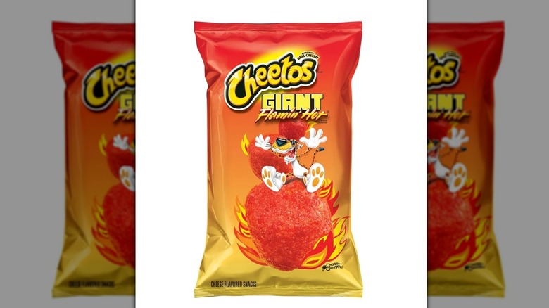 Large bag of Cheetos Giant Flamin' Hot chips on white background