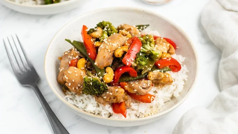 Chicken stir fry on white plate