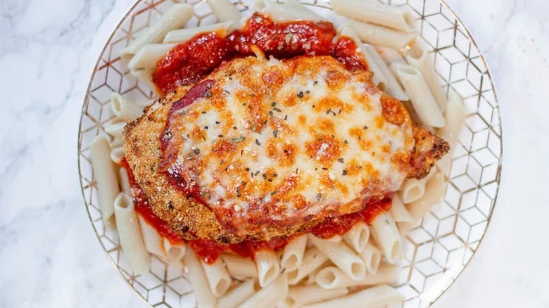 Chicken parmesan over pasta