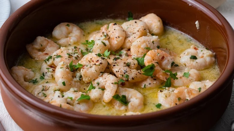 Shrimp scampi served in a ramekin 