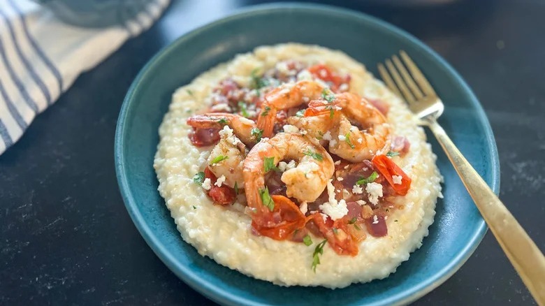 Grits topped with shrimp and feta