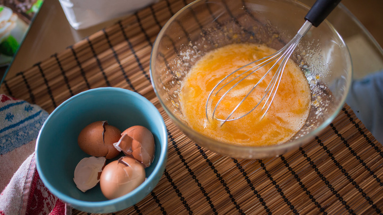 Eggs in bowl with whisk