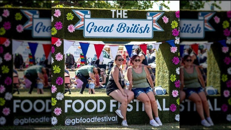 women sitting at food festival