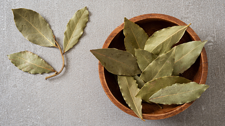 Wooden bowl of bay leaves