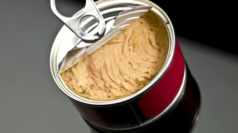 half-opened red can of tuna