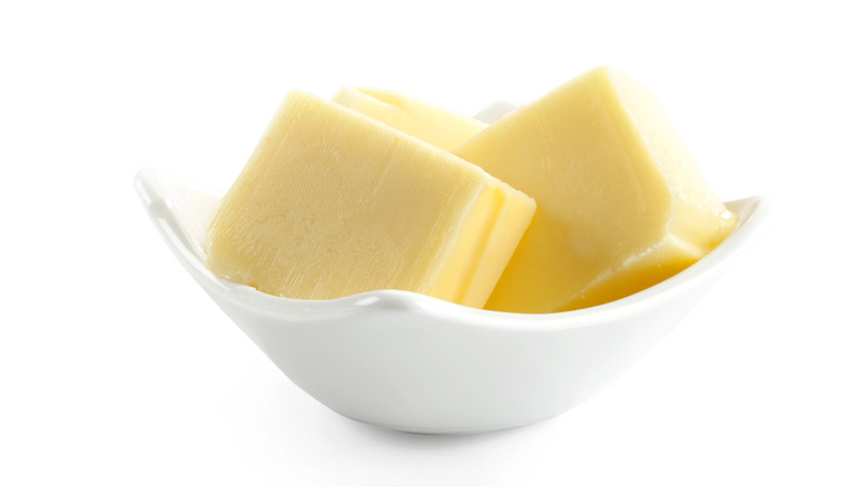 pats of butter in bowl