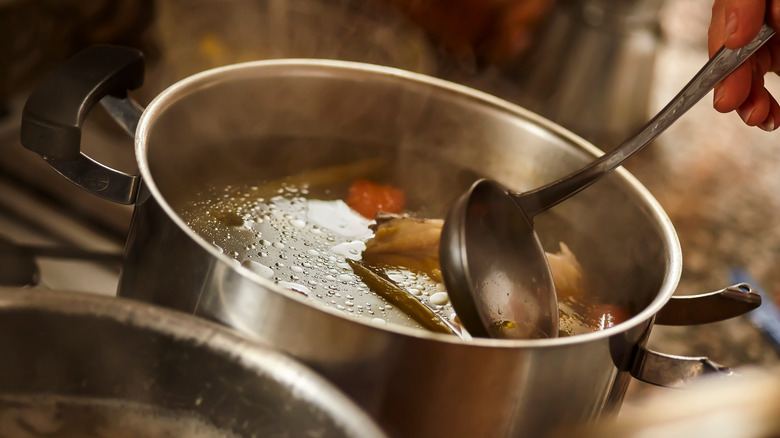 Ladle in simmering stock