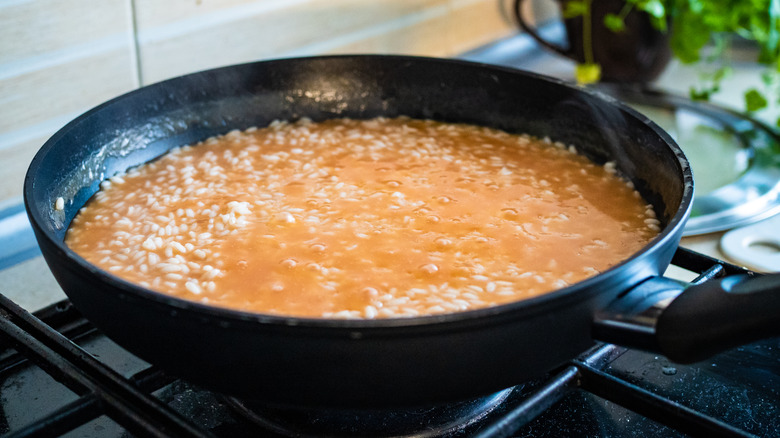 Risotto simmering in pan