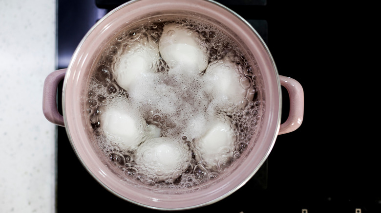 Eggs boiling in a pan