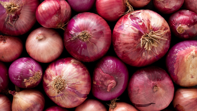 A pile of red onions