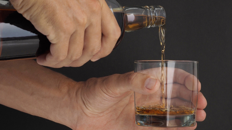 Man pouring Dominican rum