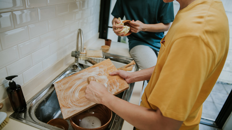 hand washing a cutting board