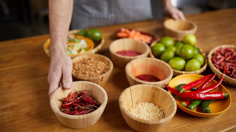 Seasonings in small wooden bowls