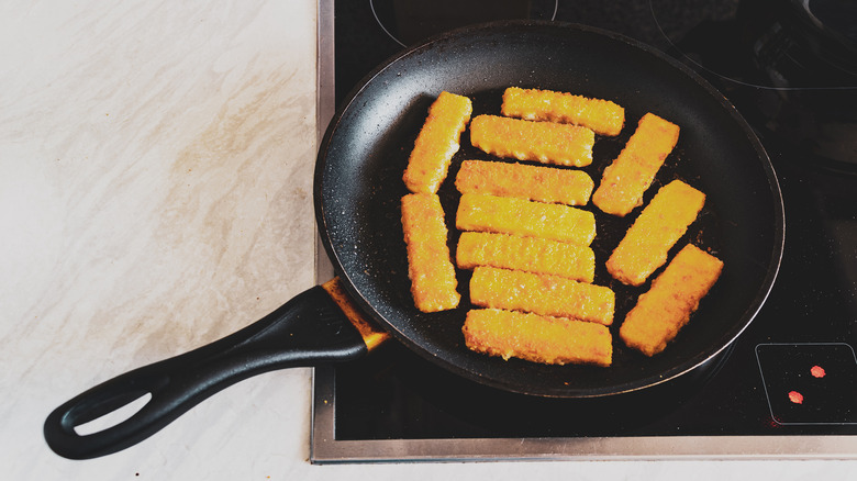 Fish sticks in frying pan