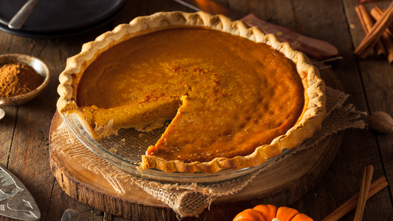 pumpkin pie with slice missing