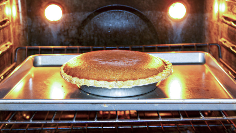 pumpkin pie in oven