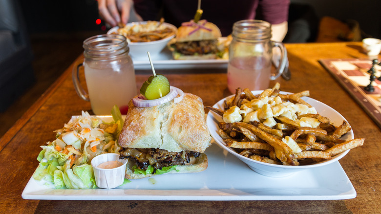 poutine, sandwich, and salad